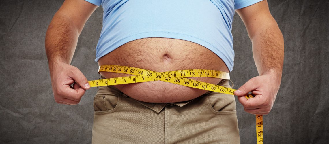 Fat belly. Man with overweight abdomen. Weight loss concept.